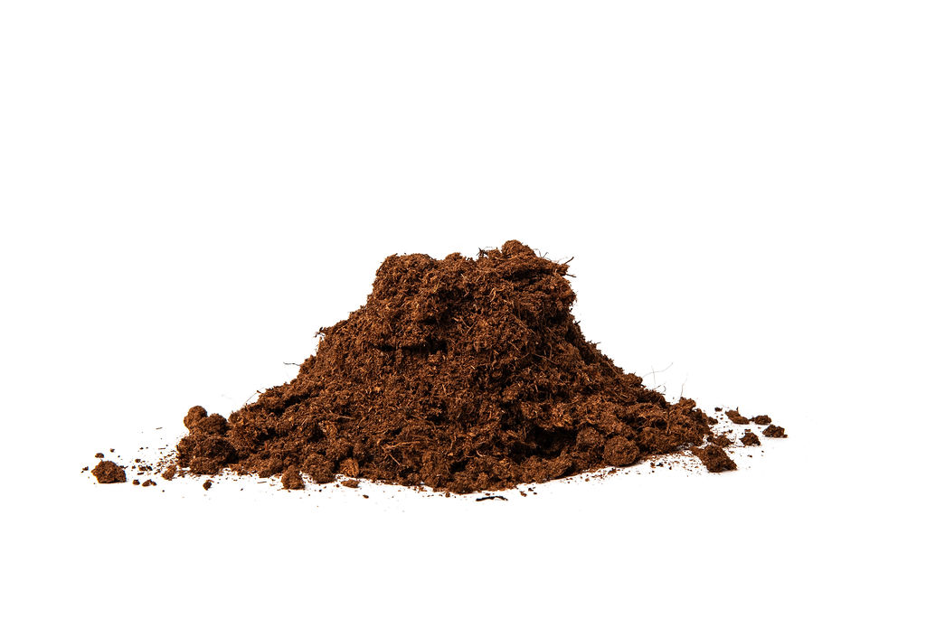 A pile of white peat with a 0-20mm particle size, featuring a fibrous and airy texture, ideal for improving soil aeration and water retention in horticultural applications.