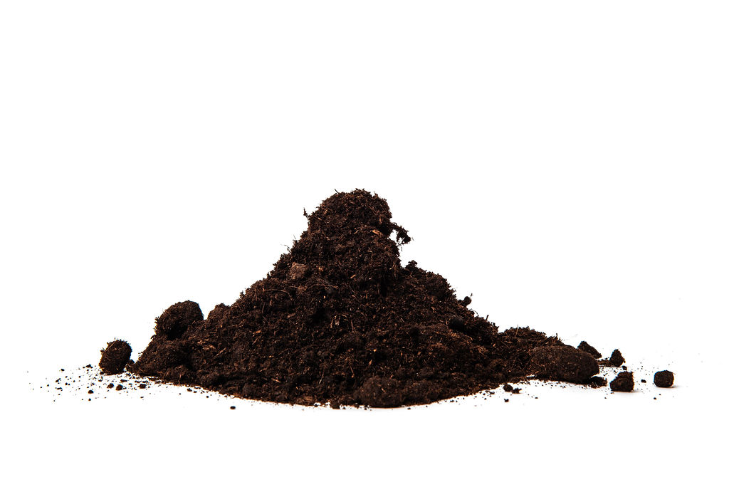 A pile of black peat with a 0-20mm particle size and adjusted pH level, featuring a fine and nutrient-rich texture, ideal for enhancing soil structure, moisture retention, and plant growth in horticultural applications.