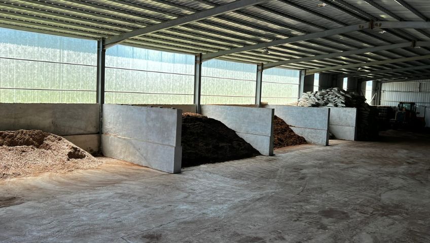 Peat bunkers inside the WOAN-ETEPEK factory in China, showcasing organized storage for raw materials used in substrate production.