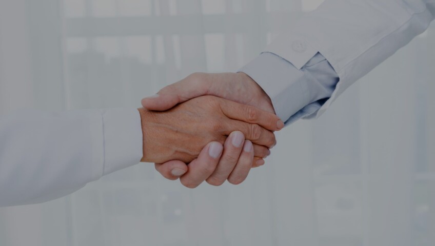 Close-up of a handshake symbolizing reliable partnership and collaboration.